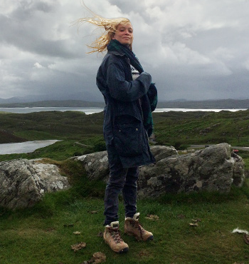 Alice Jensen standing on a Scottish hilltop