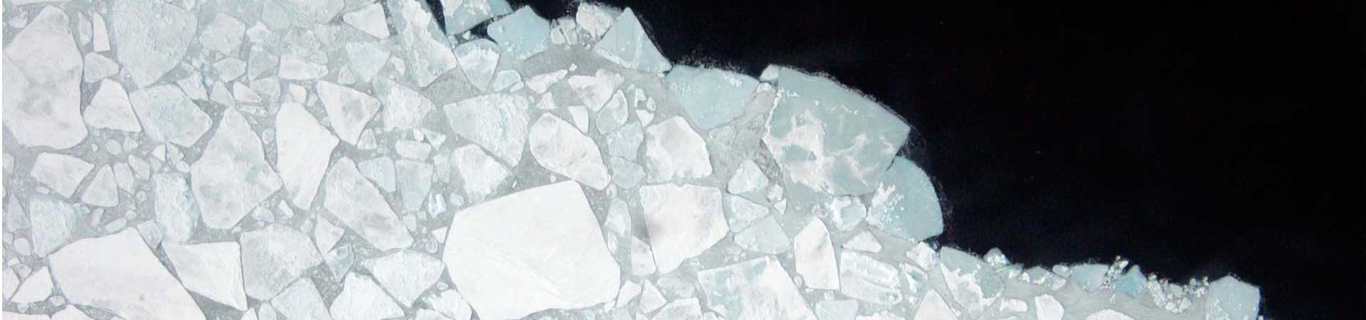 Drone footage of the margins of Arctic sea ice with water appearing black