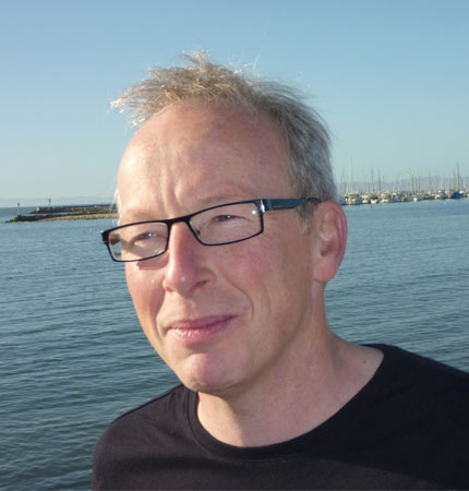 
        Professor Burrows with the coastal ocean in the background
        