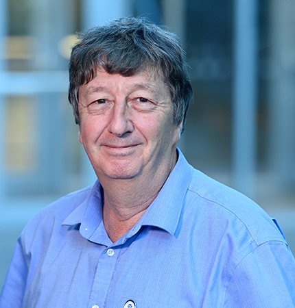 
        Corporate headshot of Douglas Wallace wearing a blue shirt
        