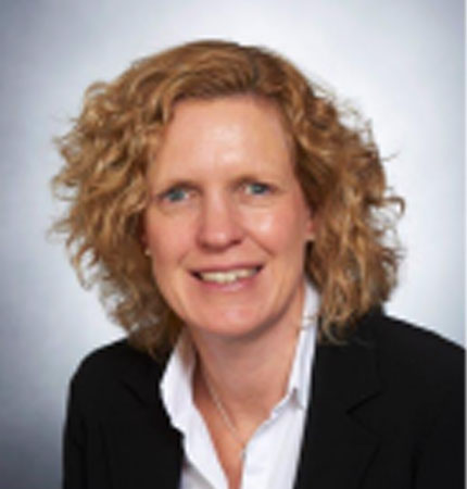 A formal head and shoulder photo of trustee Gillian Bruton smiling into the camera