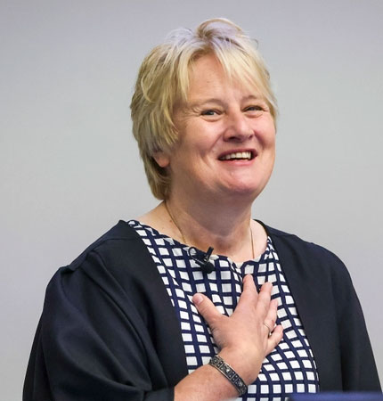 Head and shoulder photo of a smiling Karen Wiltshire during a presentation