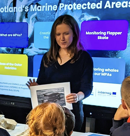 Mia Leng is inspiring school pupils about marine science in a classroom