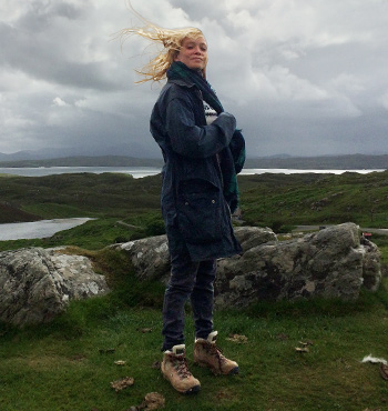 
        Alice Jensen standing on a Scottish hilltop
        