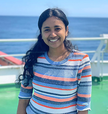Head and shoulder photo of PhD student Sneha Sunny on a boat