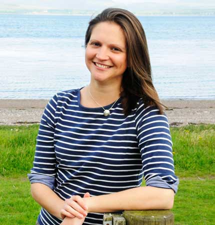 Dr Laura Hobbs outside on the SAMS back beach.