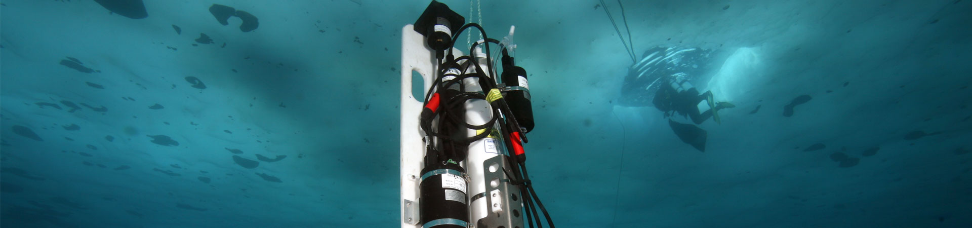 A piece of marine technology dangling below the sea ice