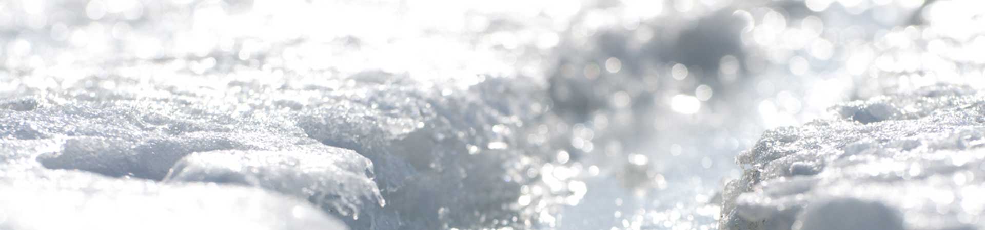 Close up of thick ice on the water surface