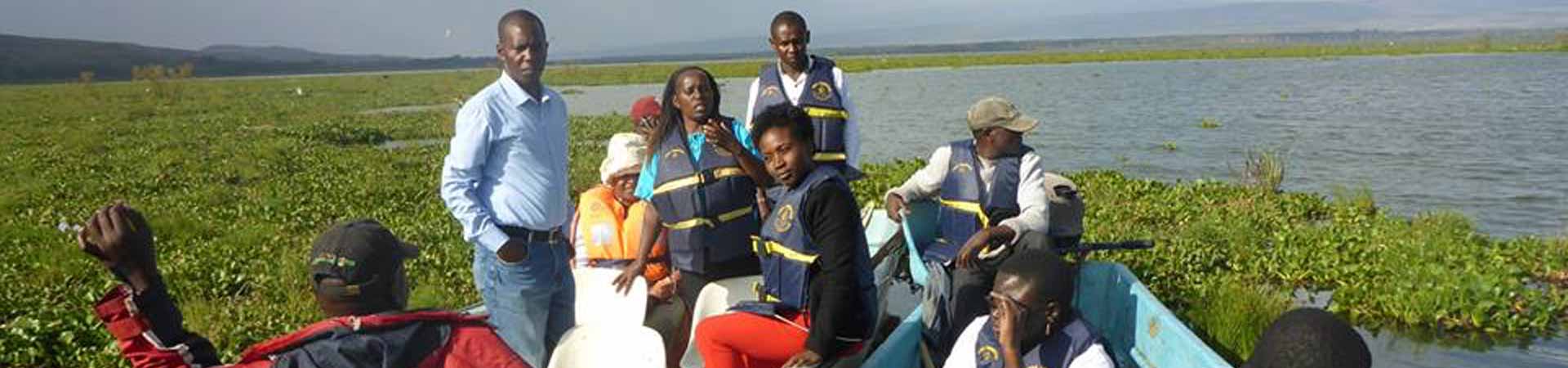Project partners in Tanzania discussing farming of freshwater fish