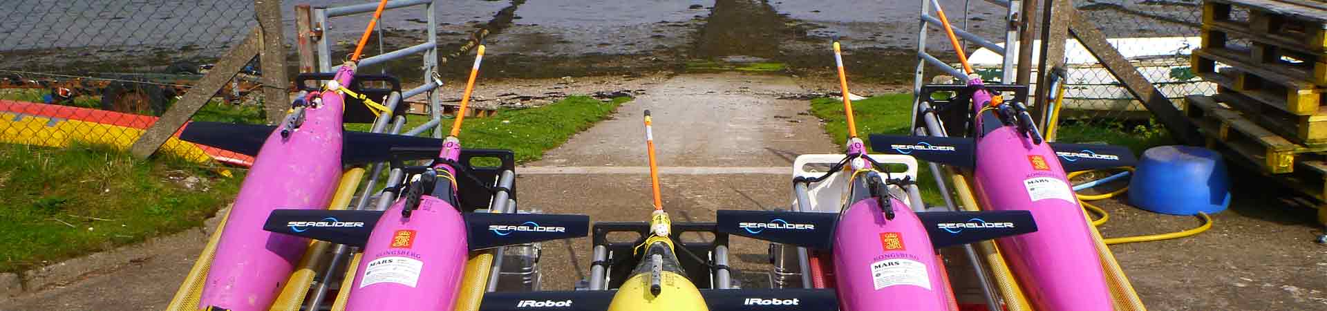 Five ocean gliders waiting to be packed up for deployment