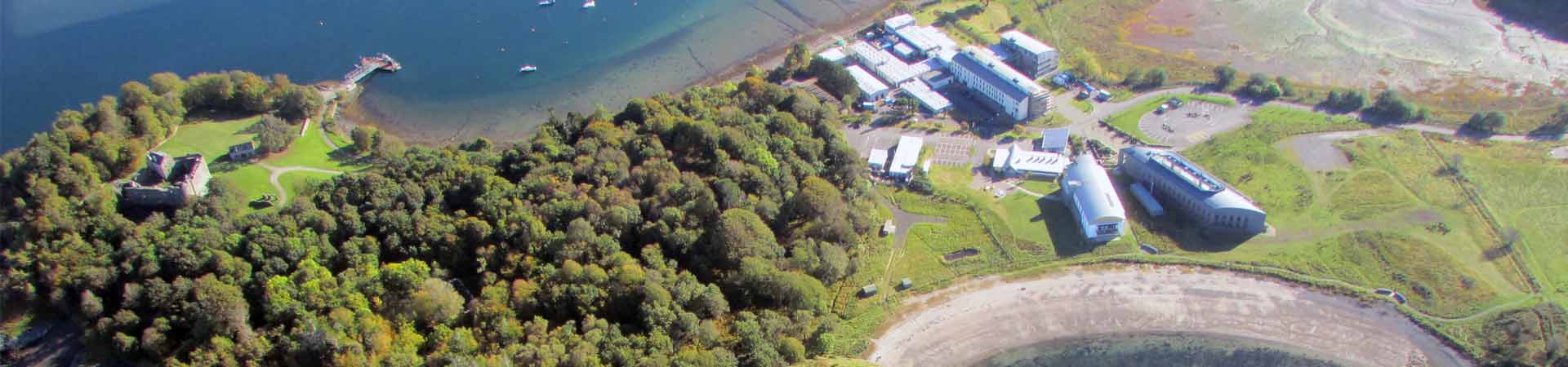 Aerial photograph of the Dunstaffnage peninsula with Dunstaffnage castle, SAMS, European Marine Science Park and SAMS' pontoon