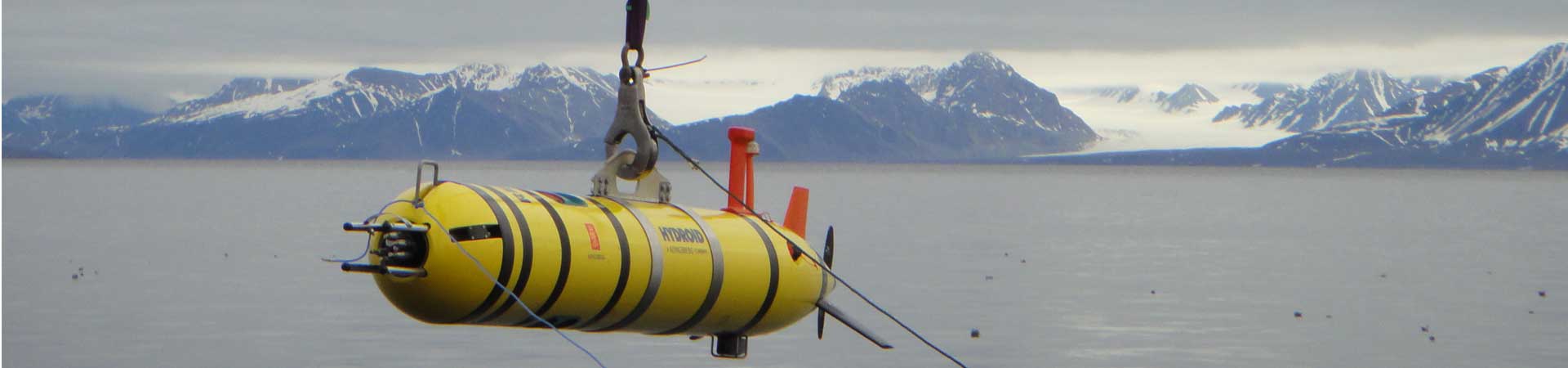 Picture shows an autonomous underwater vehicle being deployed into the Arctic Ocean