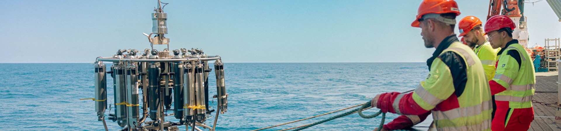 Research equipment being lowered into the ocean