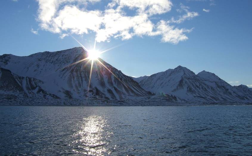 The sun rises over Kongsfjorden, Svalbard, where much of the research took place