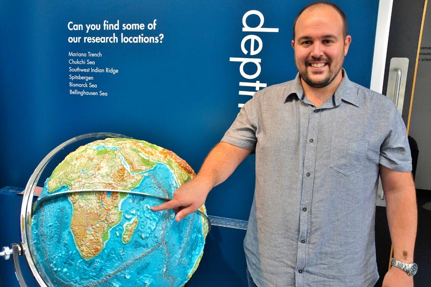 Seychelles-bound Dr Ander de Lecea points out his next destination during a return visit to SAMS UHI