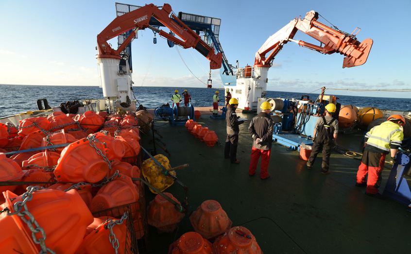 Oceanographic moorings are prepared for deployment in the North Atlantic