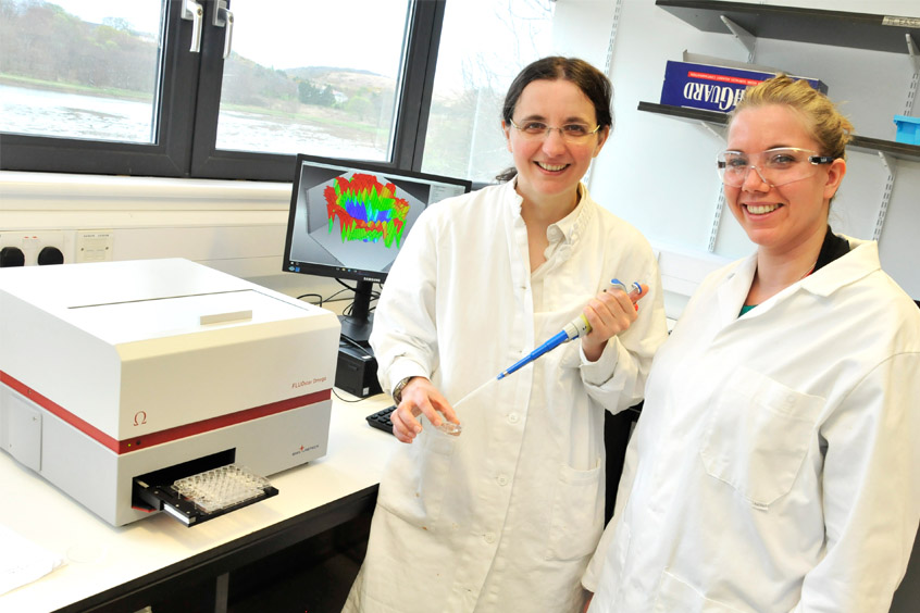 Dr Claire Gachon, left, receives the new NEPHELOstar machine from Natacha Pavone of BMG Labtech. The microplate reader will be used to help breed disease resistant algae for the seaweed-growing industry