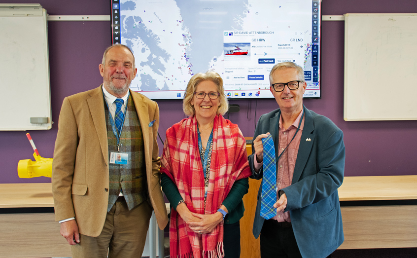 SAMS Director Prof Nick Owens, left, and Associate Director for Science and External Engagement Prof Elizabeth Cottier-Cook welcome Brendan O'Hara MP to SAMS. On Mr O'Hara's arrival, there was an exchange of tartans - the MP was presented with a SAMS Ocean Explorer tie and Prof. Cottier-Cook received a Greenland tartan serape.