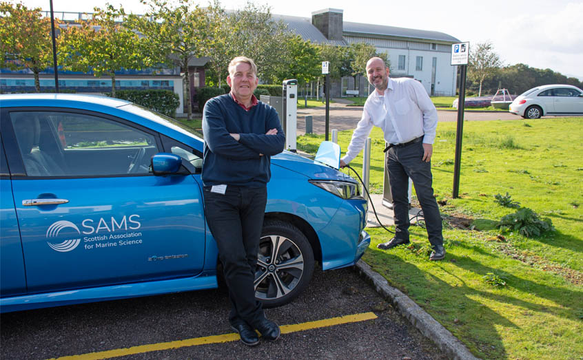 Charging up the SAMS electric car at the new charging points are SAMS Deputy Director Prof Axel Miller, left, and Chris Clay, safety, health and environment adviser.