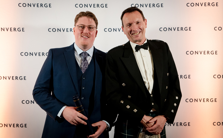 Masters student Thomas Bartram, left, and Head of SAMS Enterprise Steve Ham, on behalf of Prof. Adam Hughes, picked up prizes at the Converge Awards 2026  