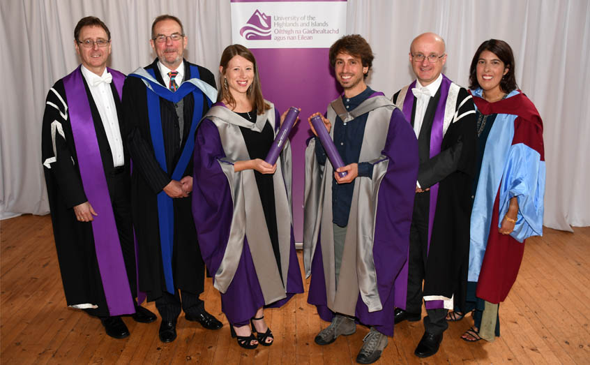 The first two PhD graduates from the University of the Highlands and Islands, Dr Winnie Courtene-Jones and Dr Andrea Garvetto are congratulated by, from left: University of the Highlands and Islands Dean of Research Michael Rayner, SAMS UHI Director Prof Nicholas Owens, university Vice-Principal Prof Neil Simco and Head of SAMS UHI Graduate School Dr Bhavani Narayanaswamy.  