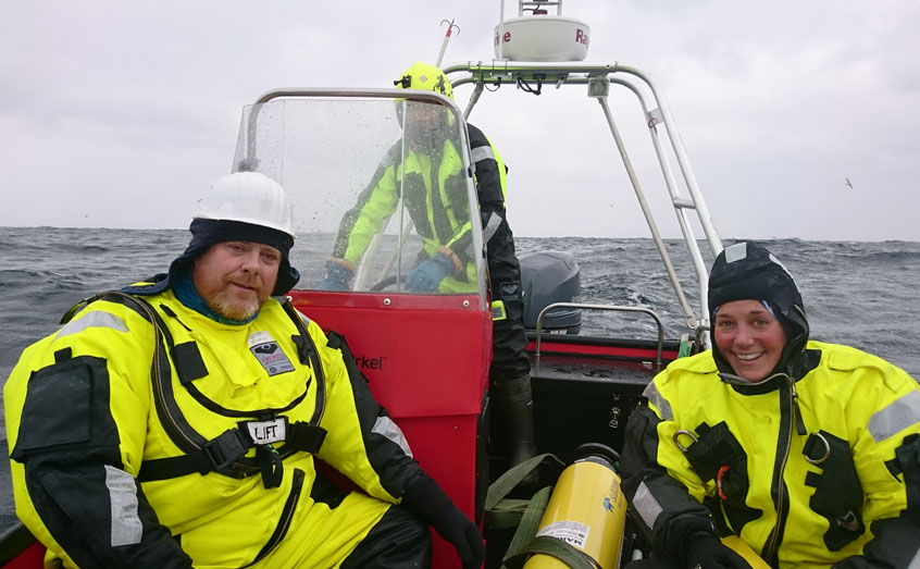 Prof Jorgen Berge, UiT and Dr Emily Venables, SAMS retrieve a glider from the Barents Sea during the Arctic PRIZE April cruise