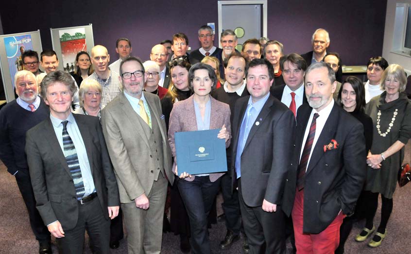 Prof Graham Shimmield’s widow, Jane, holds a book of remembrance signed by guests at the SAMS event to celebrate the life and career of the former director.