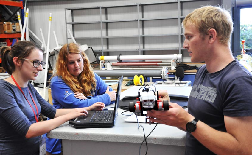 NEXUSS students programming a Lego Mindstorm 