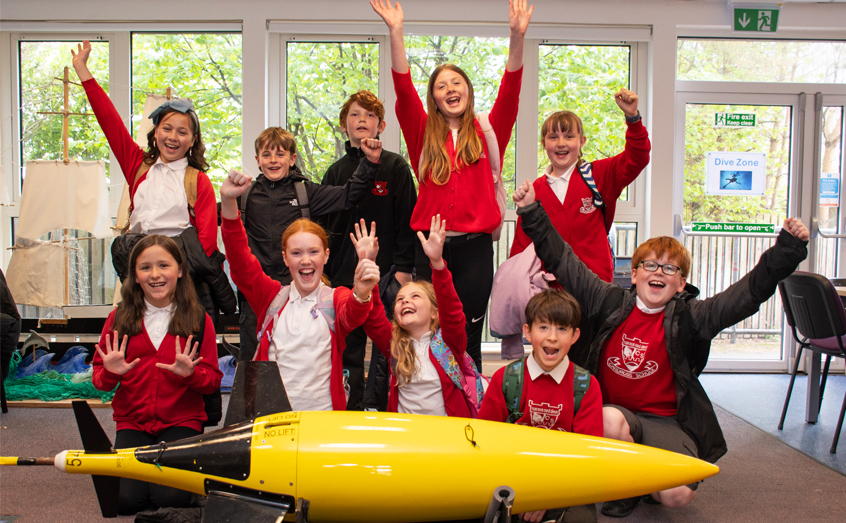 The winning pupils from Cardross Primary School pictured with a model Seaglider, an autonomous underwater vehicle, during a recent visit to SAMS. 