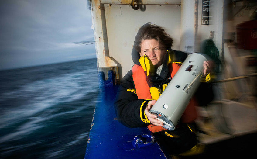 Dr Susannah Calderan deploys an acoustic instrument to track blue whales by listening for their sounds, during the 2015 Antarctic blue whale voyage. (Photo: Dave Allen)