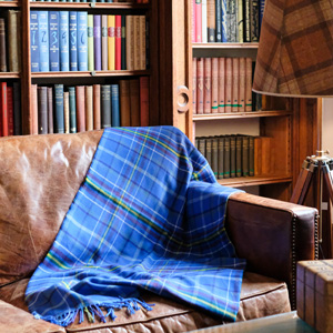 Tartan blanket on the sofa in a manor house library